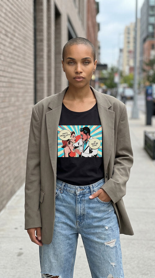 Load image 1 in gallery view. Person wearing a graphic t-shirt with a colorful design, standing on a city street.