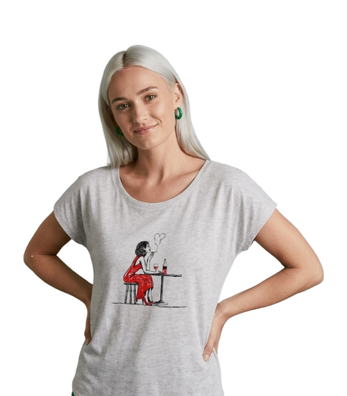Load image 1 in gallery view. Woman wearing a white t-shirt with a graphic design on a white background
